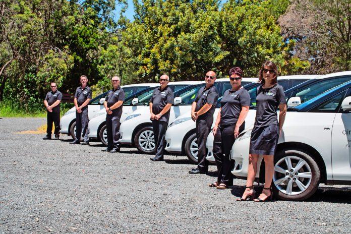 private airport transfers Chauffers standing in fronts of their cabs